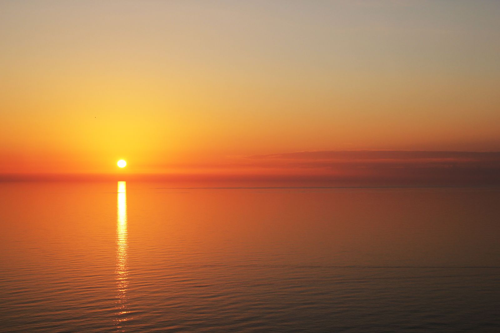 A calm sea at golden sunset
